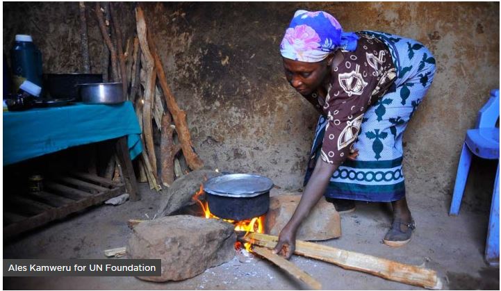 woman and wood fire Stove top Alliance